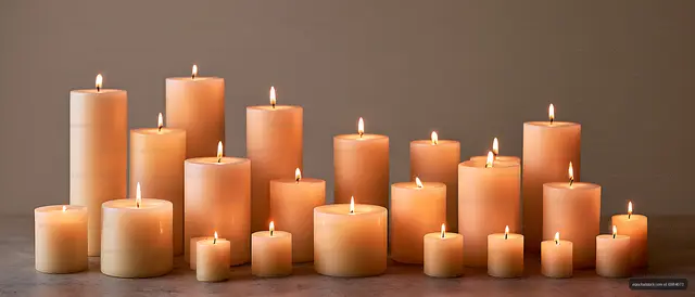 Multiple lit candles creating a warm still life