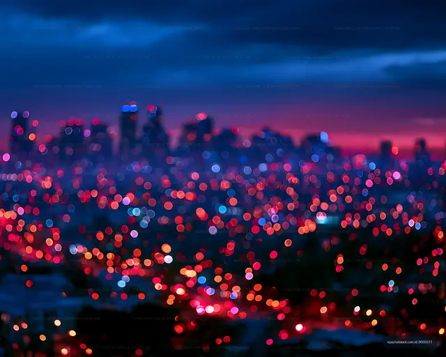 Vibrant blurred city lights beneath a twilight sky