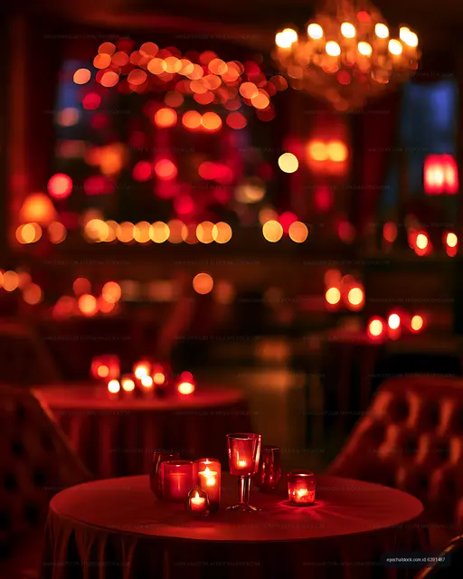 Glowing candles on a round table with atmospheric bokeh