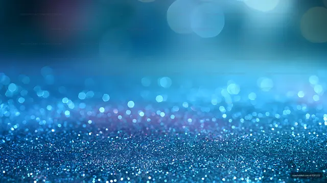 Shimmering blue glitter texture with soft bokeh