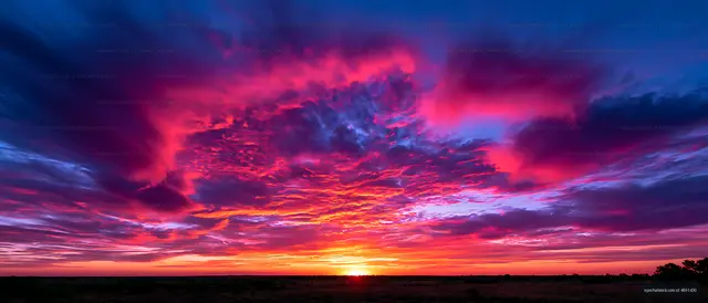 Brilliant sunset beneath vivid multicolored clouds
