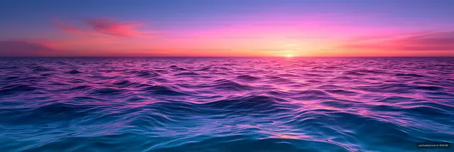 Pink and purple light on ocean waves at sunset