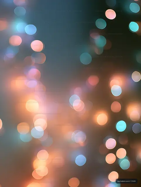 Multicolor glowing bokeh circles on an abstract background