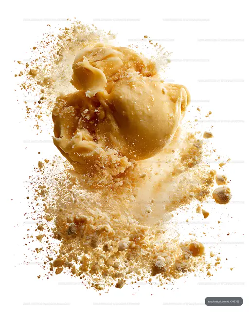 Close-up golden dumplings with sauce splash