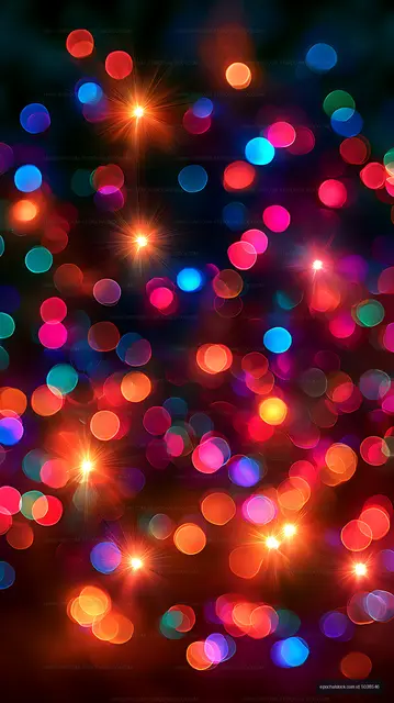 Multicolor bokeh lights and radiant flares in a dark abstract scene