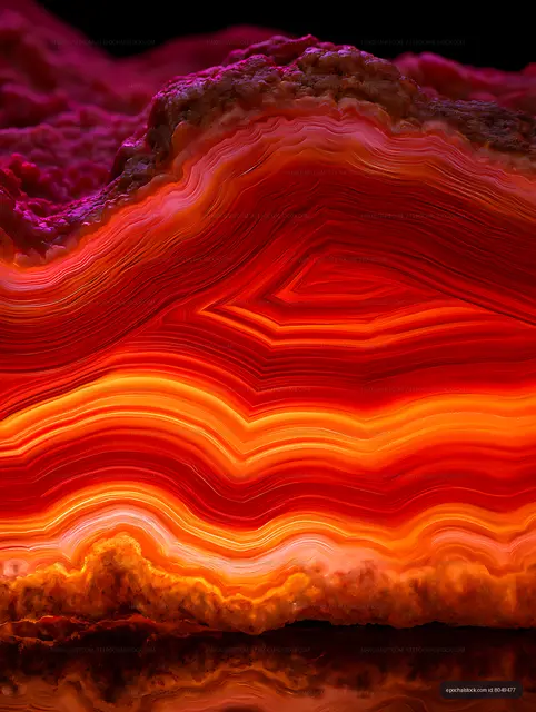 Banded agate mineral texture with vivid warm colors