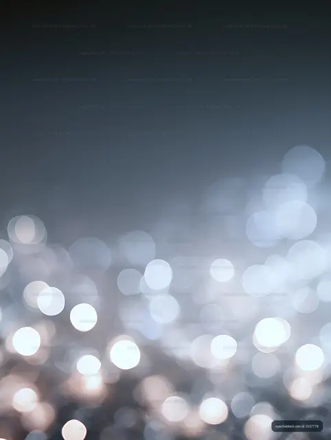 Blue bokeh light background with bright circular reflections