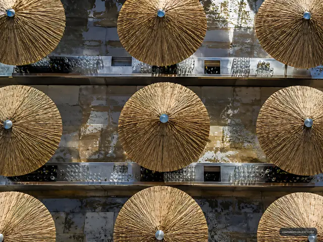 Straw umbrellas arranged on a bar counter
